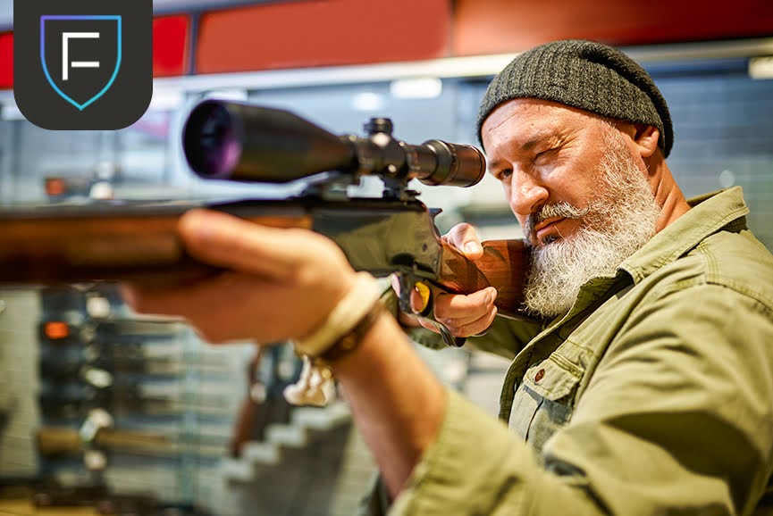 man holding rifle Man holding Gun