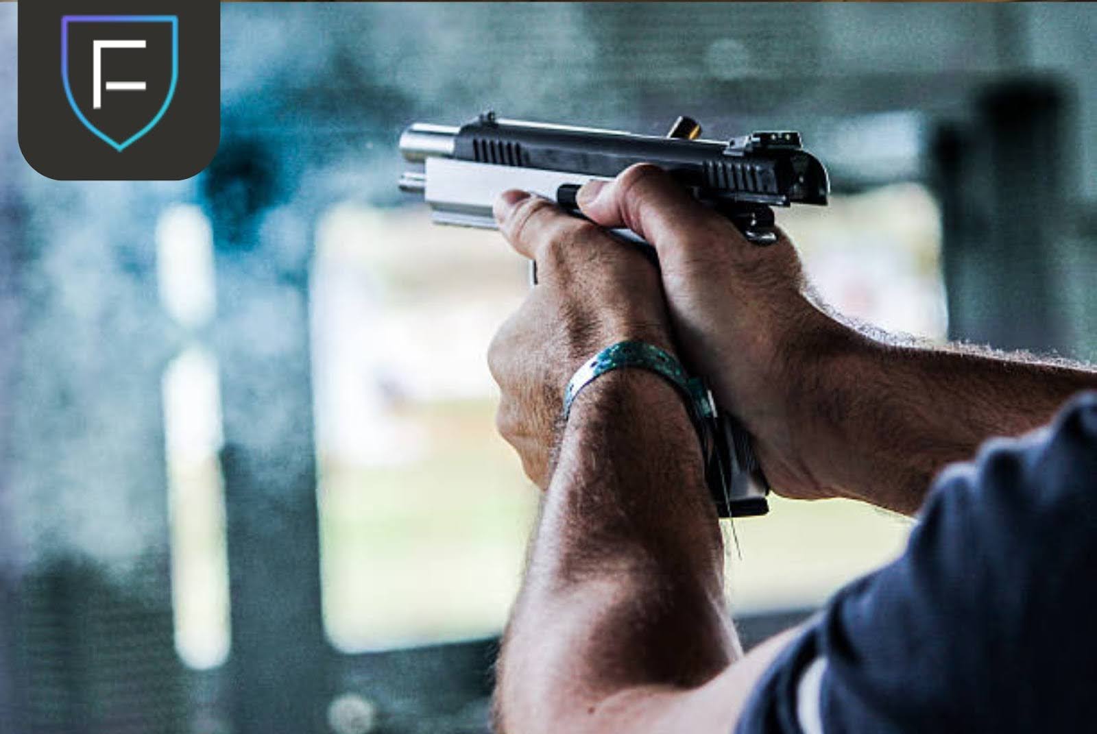 unnamed man holding gun